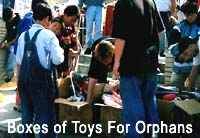 Unpacking boxes of toys collected for deaf orphans in South Korea
